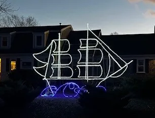 Illuminated sailing-ship display, the agency's clipper-ship emblem